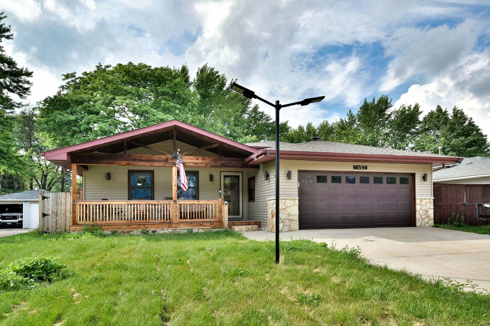 9N590 Flora Drive Elgin, IL 60123 - Photo 2 of 31 a view of house with yard and entertaining space