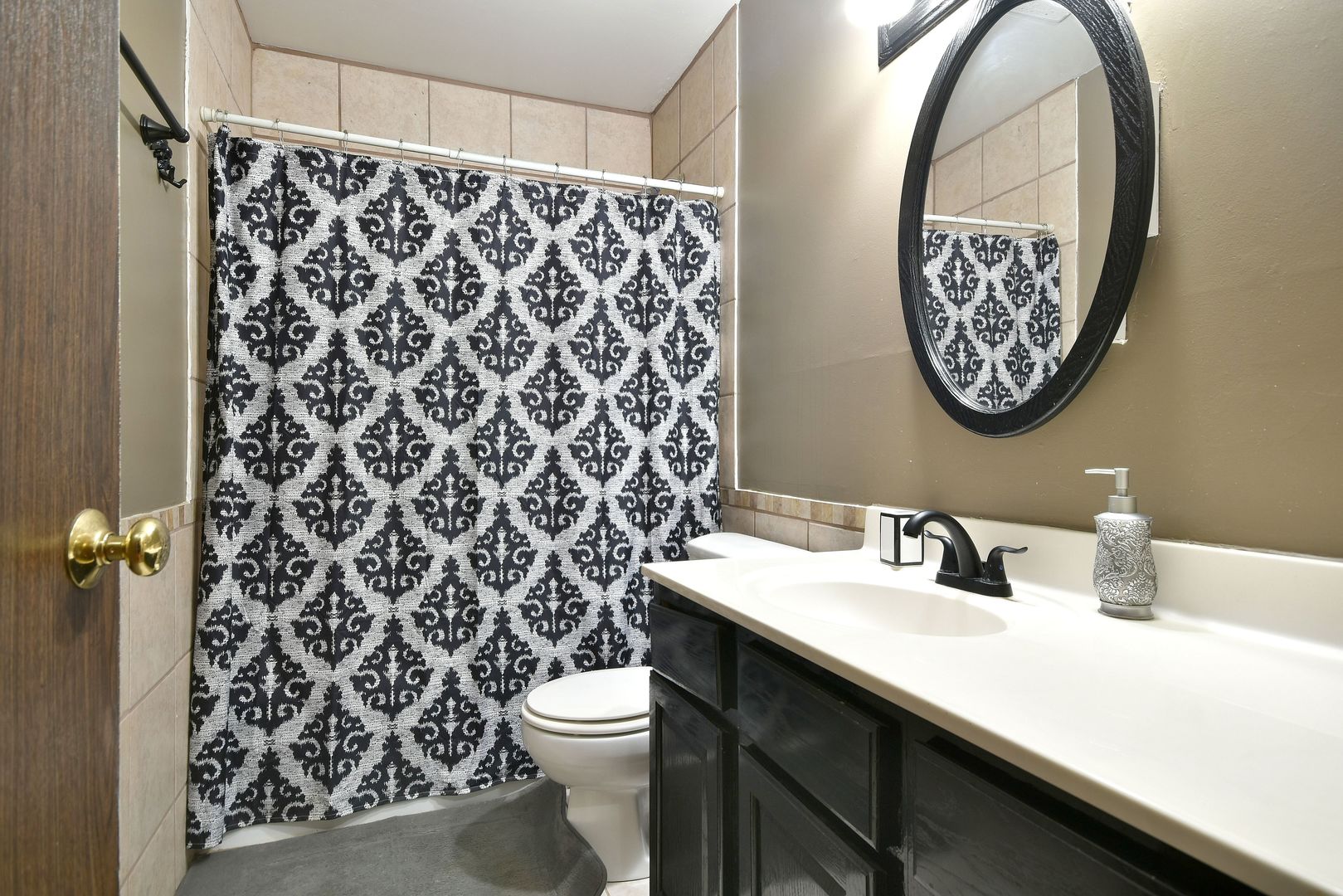 9N590 Flora Drive Elgin, IL 60123 - Photo 21 of 31 a bathroom with a toilet sink and mirror