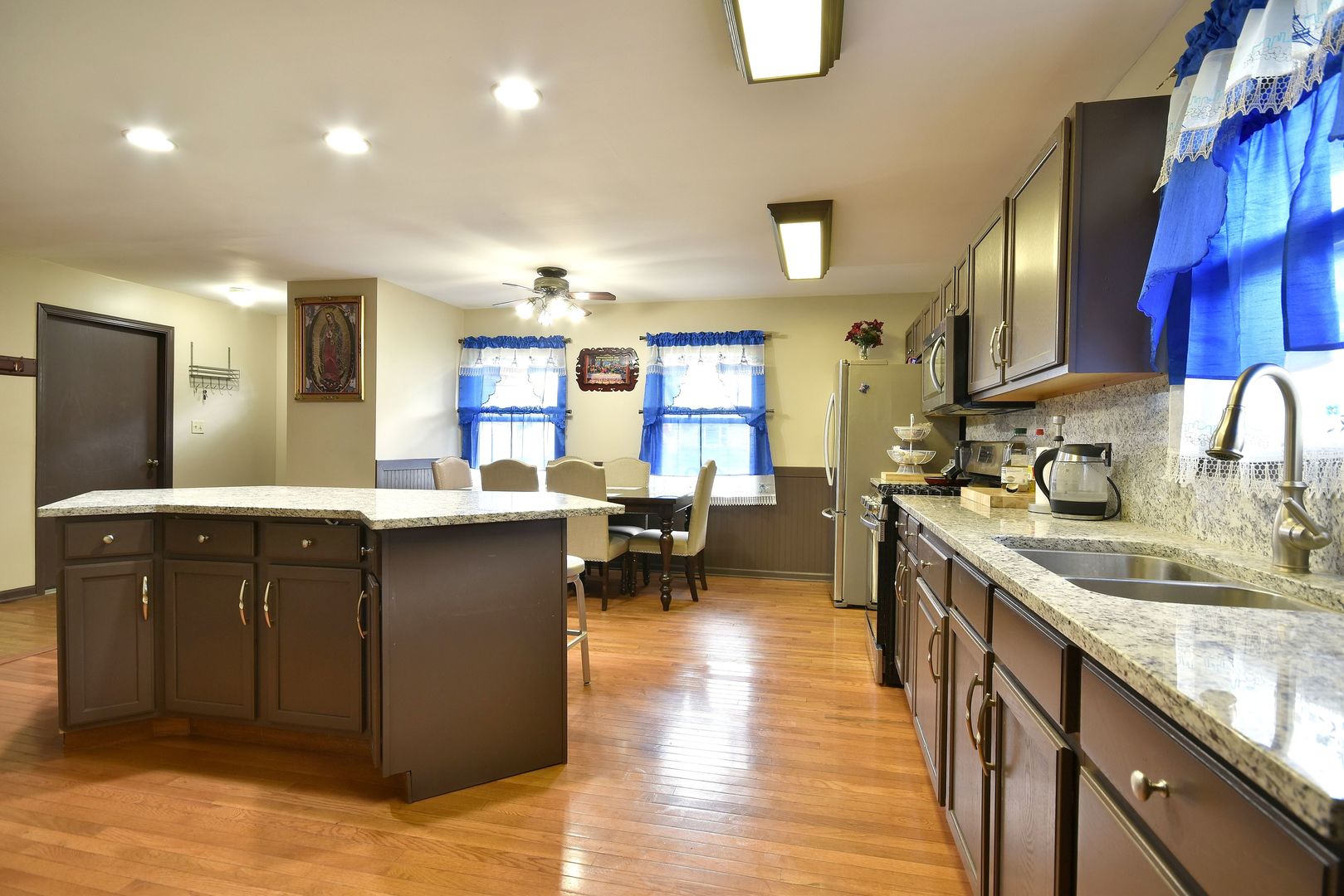 9N590 Flora Drive Elgin, IL 60123 - Photo 8 of 31 a kitchen with counter top space a sink cabinets and appliances