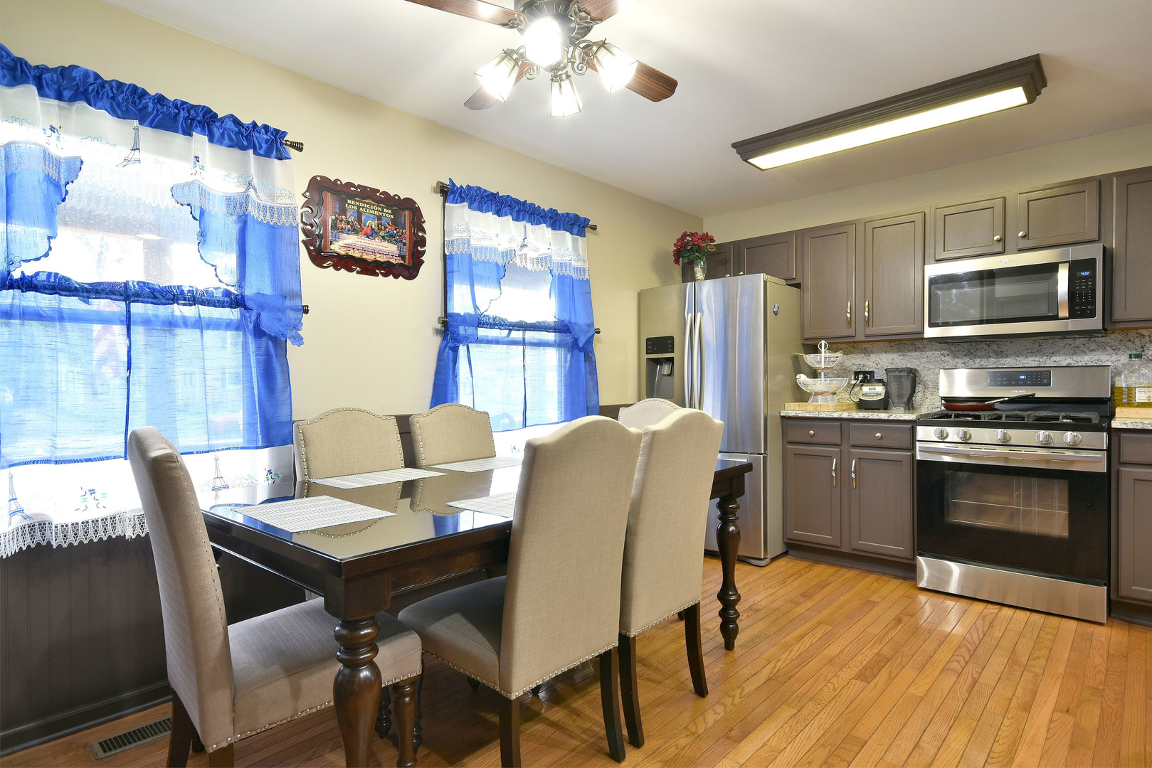 9N590 Flora Drive Elgin, IL 60123 - Photo 9 of 31 a view of a dining room with furniture and wooden floor