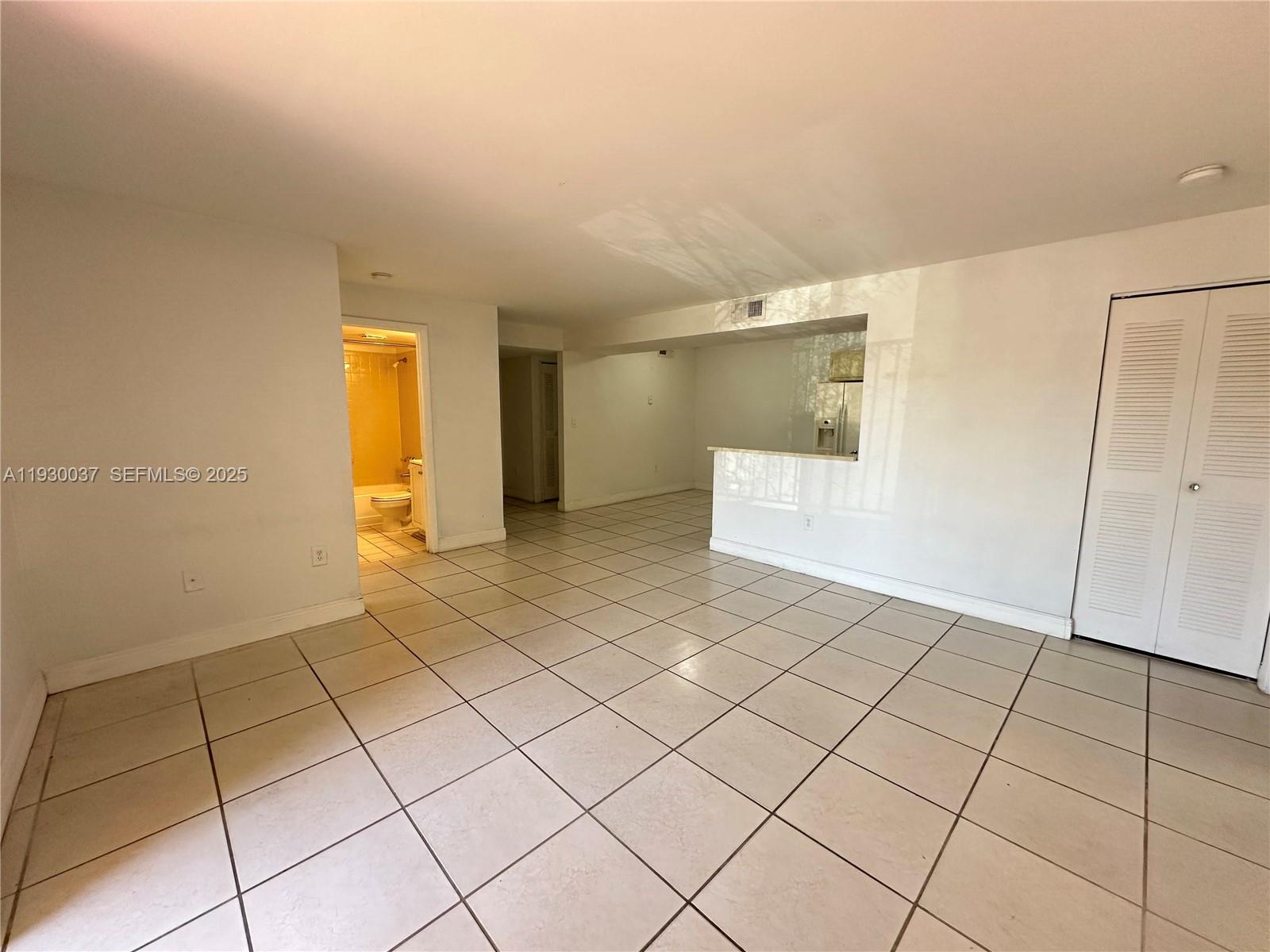 301 Palm Way, Unit 206 Pembroke Pines, FL 33025 - Photo 13 of 23 a view of an empty room and wooden floor