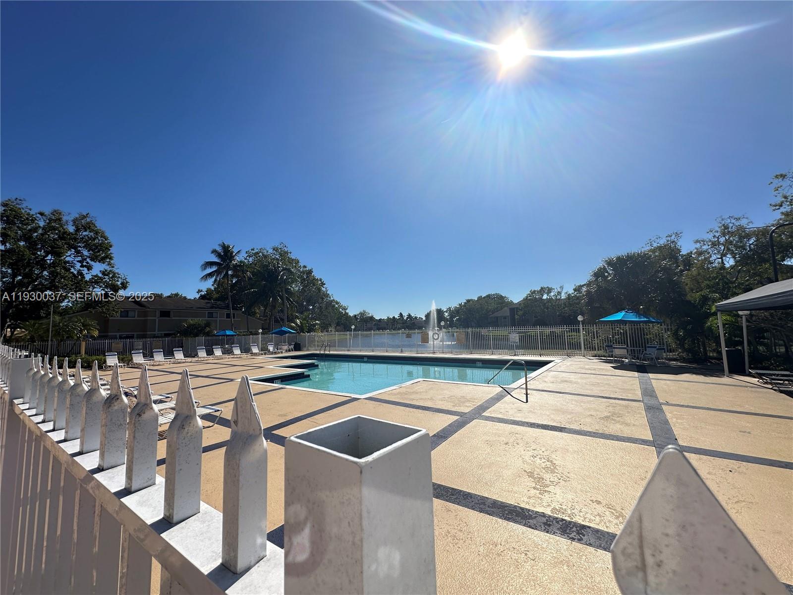 301 Palm Way, Unit 206 Pembroke Pines, FL 33025 - Photo 19 of 23 a view of swimming pool with lake view