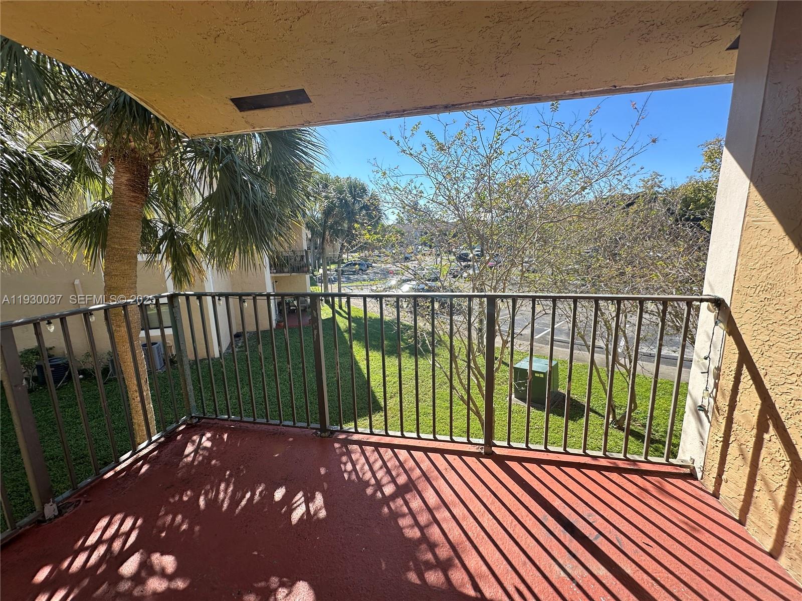 301 Palm Way, Unit 206 Pembroke Pines, FL 33025 - Photo 2 of 23 a view of a balcony with an outdoor space
