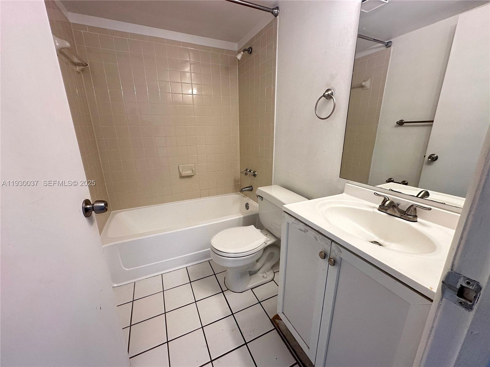 301 Palm Way, Unit 206 Pembroke Pines, FL 33025 - Photo 8 of 23 a bathroom with a sink a toilet and shower
