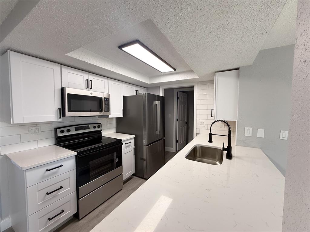 6834 Amarillo Street Port Richey, FL 34668 - Photo 6 of 31 Brand new kitchen with Stainless Steel appliances.