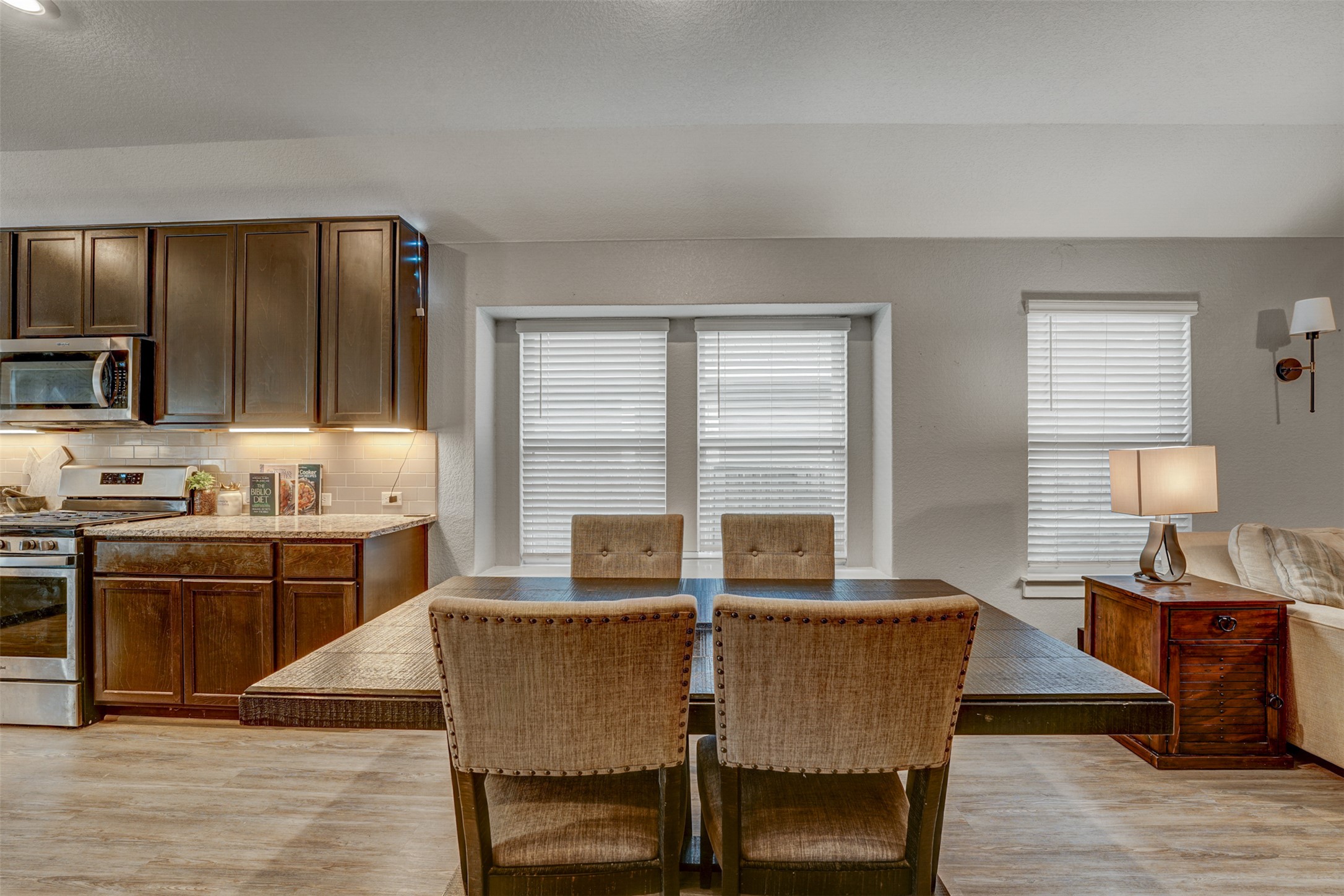 5806 Aviano Road Round Rock, TX 78665 - Photo 20 of 29 A contemporary kitchen and dining space with rich cabinetry and ample natural light.