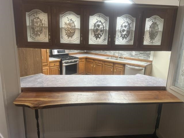 1100 Pine Top Road Toone, TN 38381 - Photo 13 of 40 Kitchen pass-through featuring a live edge wood counter