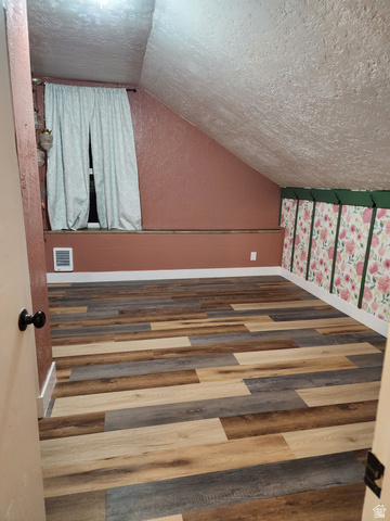 320 South State Street Preston, ID 83263 - Photo 13 of 20 Bedroom with wood finished floors and heating unit