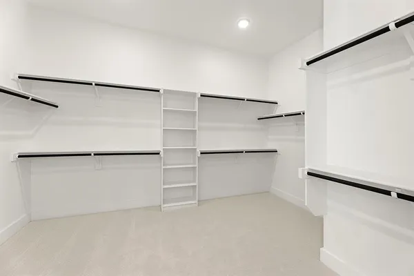 a view of an empty walk in closet