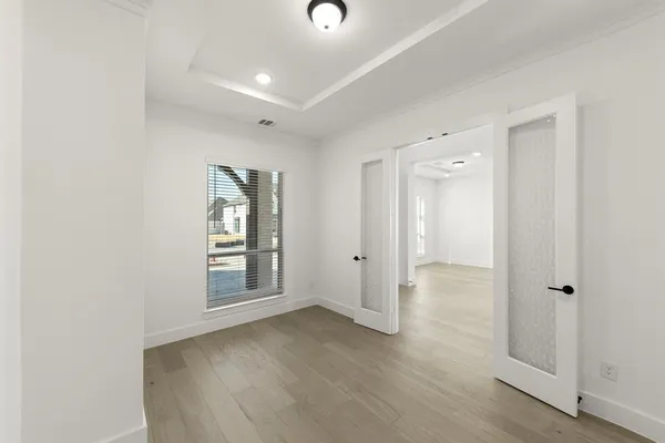 wooden floor with white walls