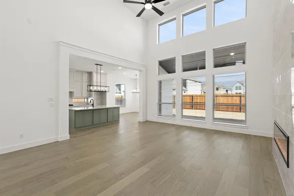 a view of a kitchen with wooden floor and a kitchen