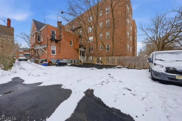 a view of a street with a building in the background