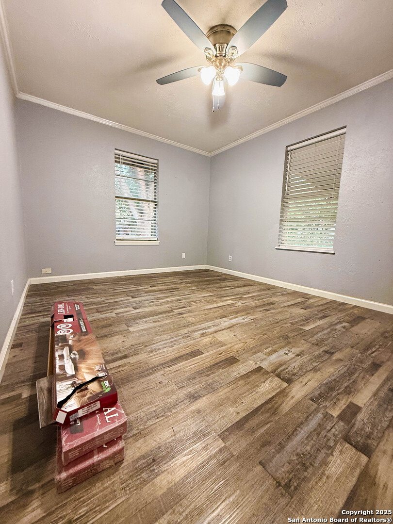 1403 West Hefferman Street Beeville, TX 78102 - Photo 12 of 15 a view of workspace with wooden floor and window