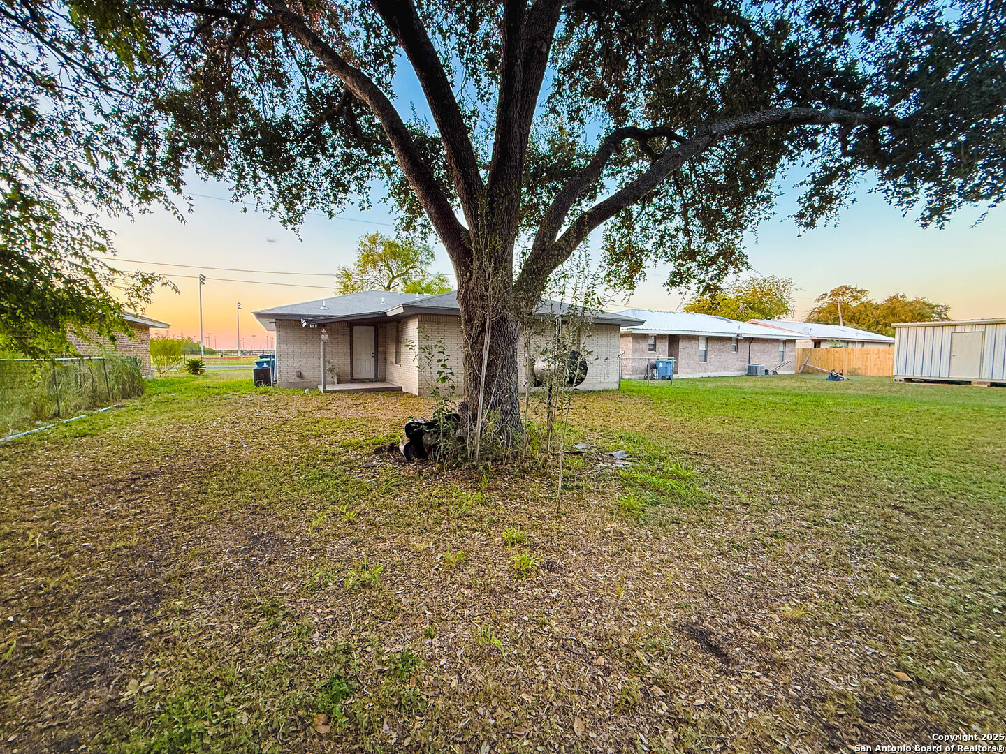 1403 West Hefferman Street Beeville, TX 78102 - Photo 14 of 15 a view of a house with a yard