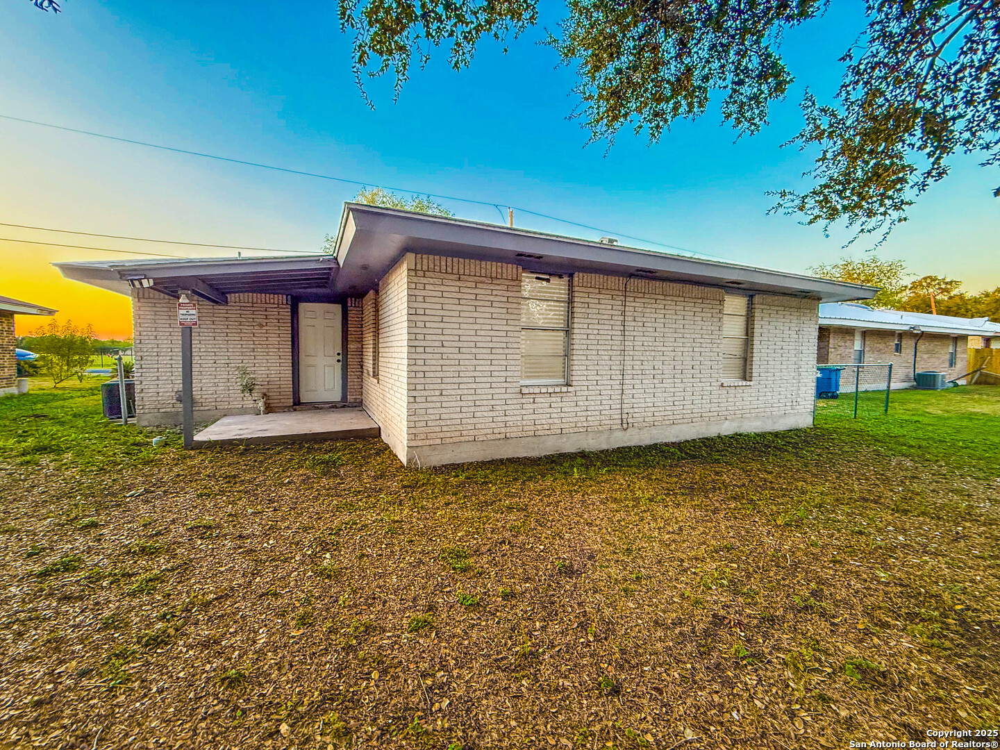 1403 West Hefferman Street Beeville, TX 78102 - Photo 15 of 15 a front view of a house with a garden