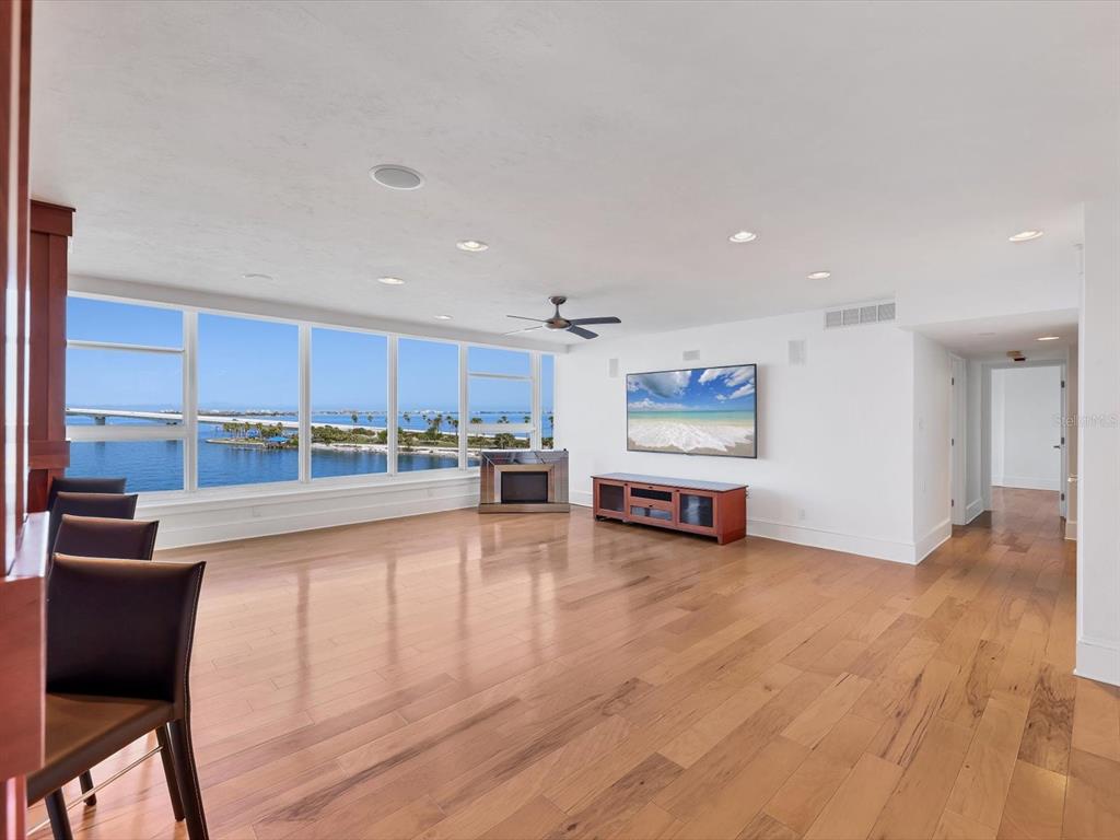226 Golden Gate Point, Unit 63 Sarasota, FL 34236 - Photo 12 of 48 a living room with stainless steel appliances furniture a rug and a kitchen view