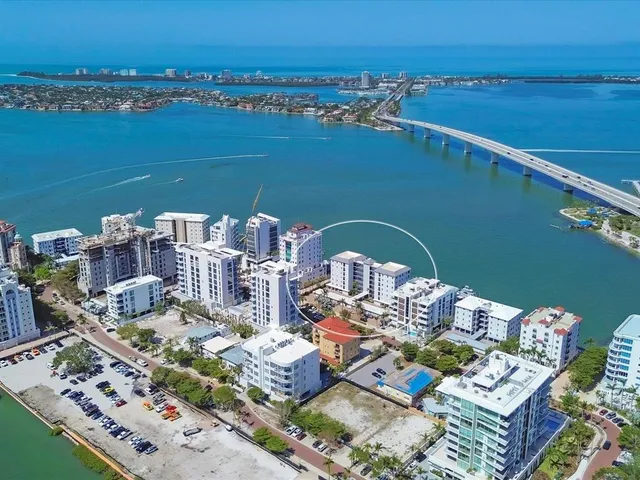 a view of city and ocean with boats
