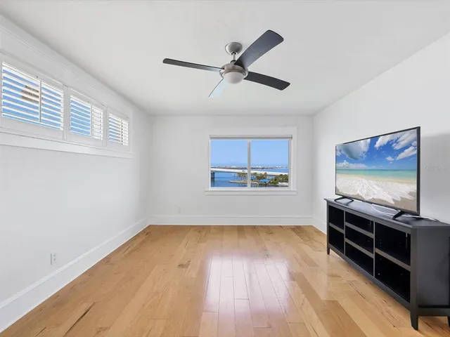 a view of room with wooden floor and window