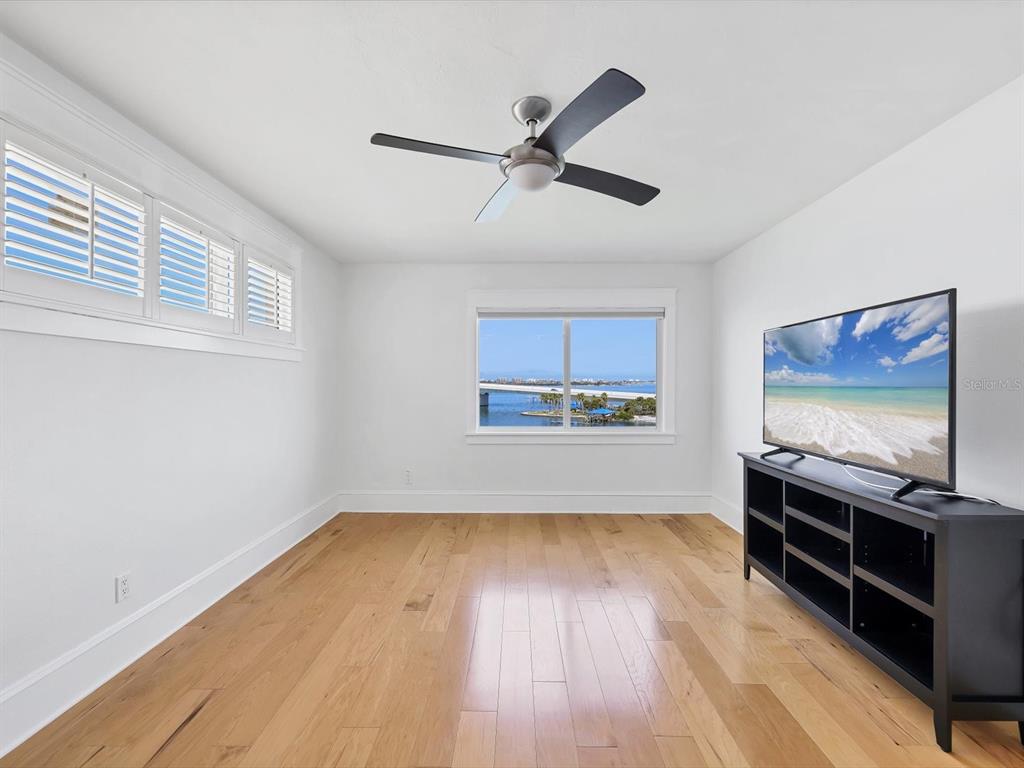 226 Golden Gate Point, Unit 63 Sarasota, FL 34236 - Photo 36 of 48 a view of room with wooden floor and window