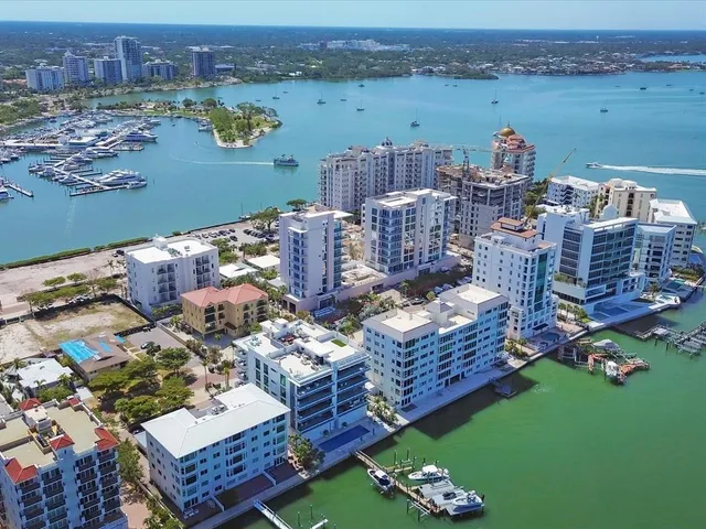 an aerial view of a house with a lake view