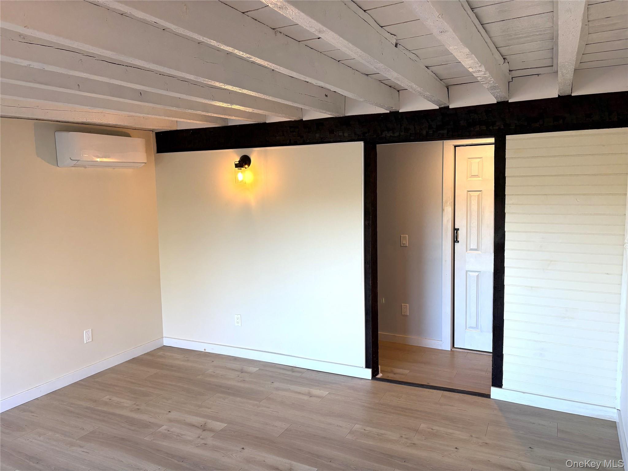 351 Co Rte 19 Hudson, NY 12534 - Photo 14 of 26 a view of empty room with wooden floor and fan
