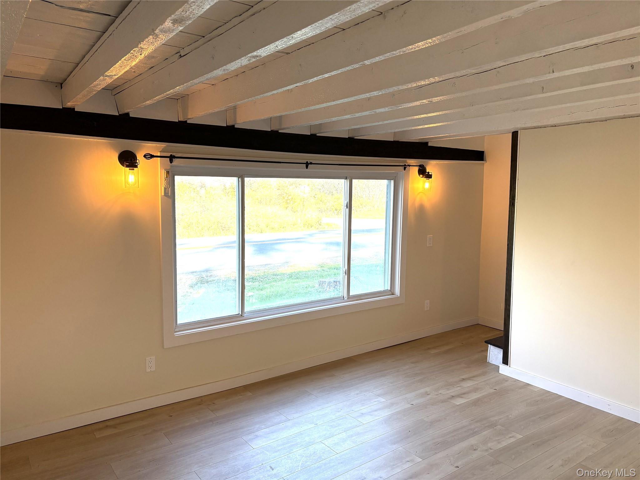 351 Co Rte 19 Hudson, NY 12534 - Photo 15 of 26 an empty room with wooden floor and a window with outer view