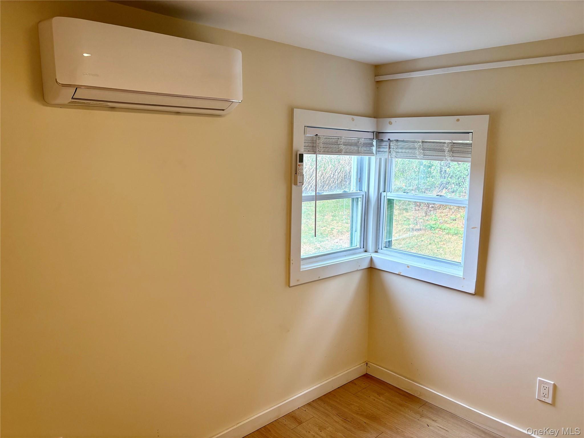 351 Co Rte 19 Hudson, NY 12534 - Photo 19 of 26 a view of an empty room with a window and wooden floor
