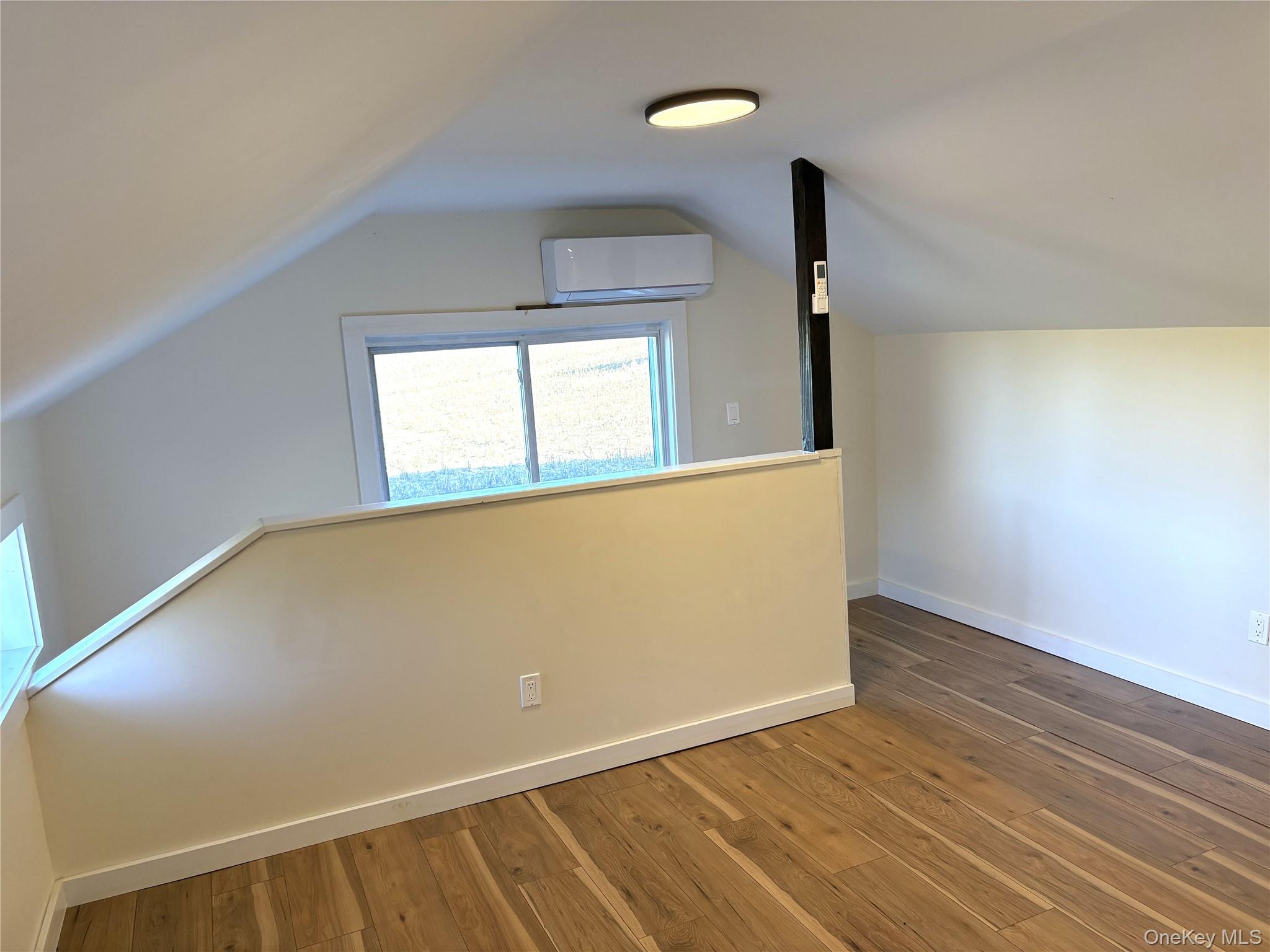 351 Co Rte 19 Hudson, NY 12534 - Photo 23 of 26 an empty room with wooden floor and windows