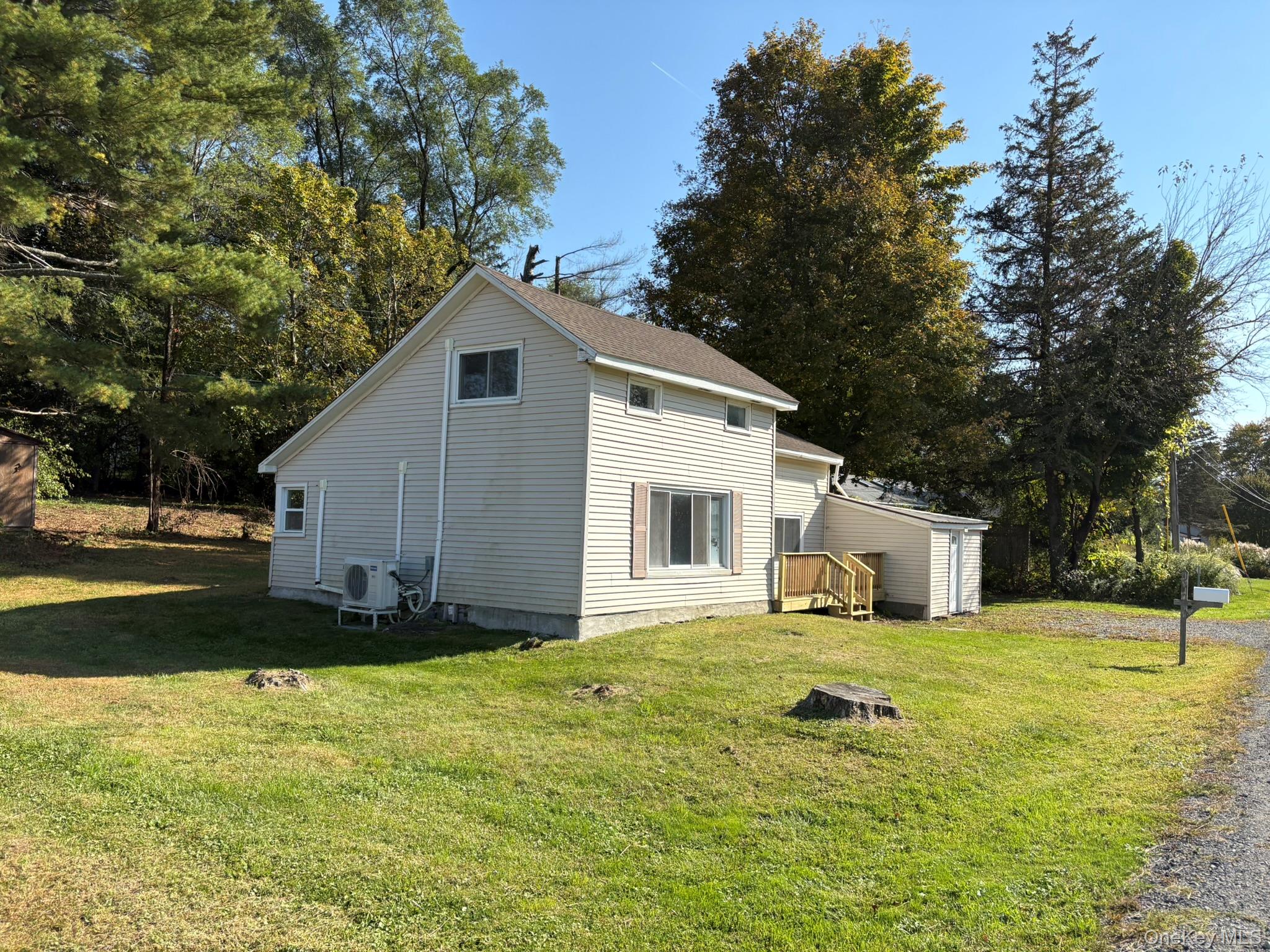 351 Co Rte 19 Hudson, NY 12534 - Photo 3 of 26 a front view of house with yard and trees in the background