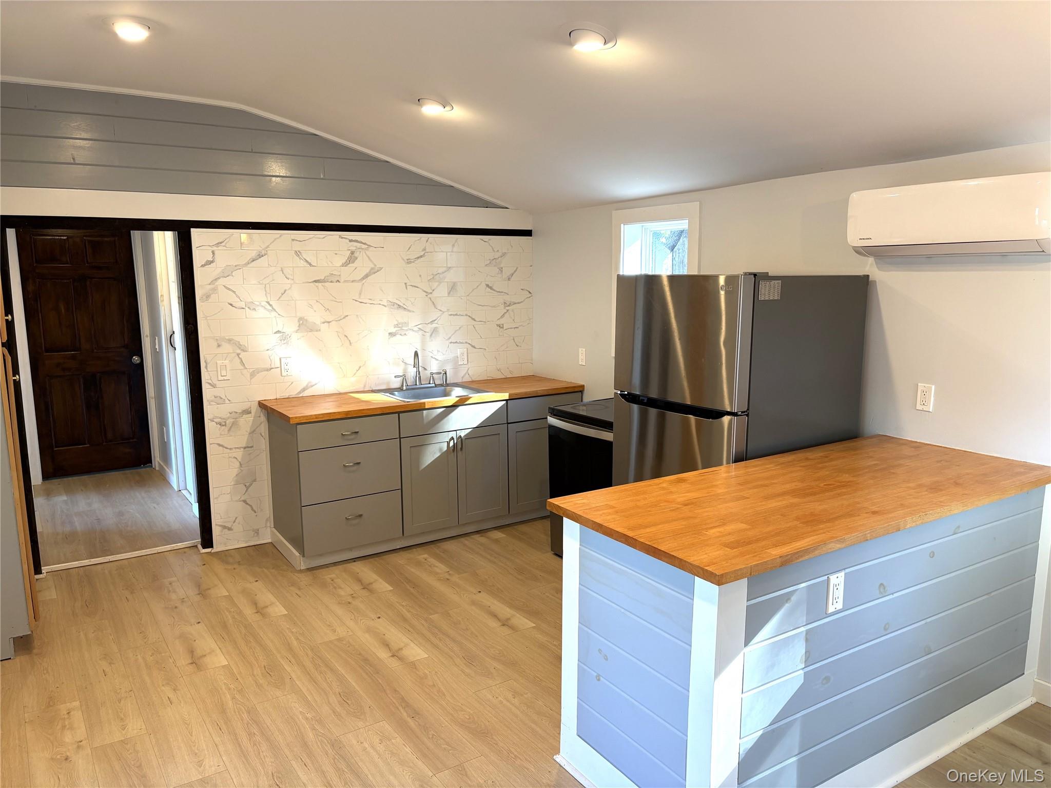 351 Co Rte 19 Hudson, NY 12534 - Photo 8 of 26 a kitchen with stainless steel appliances granite countertop a refrigerator and a sink