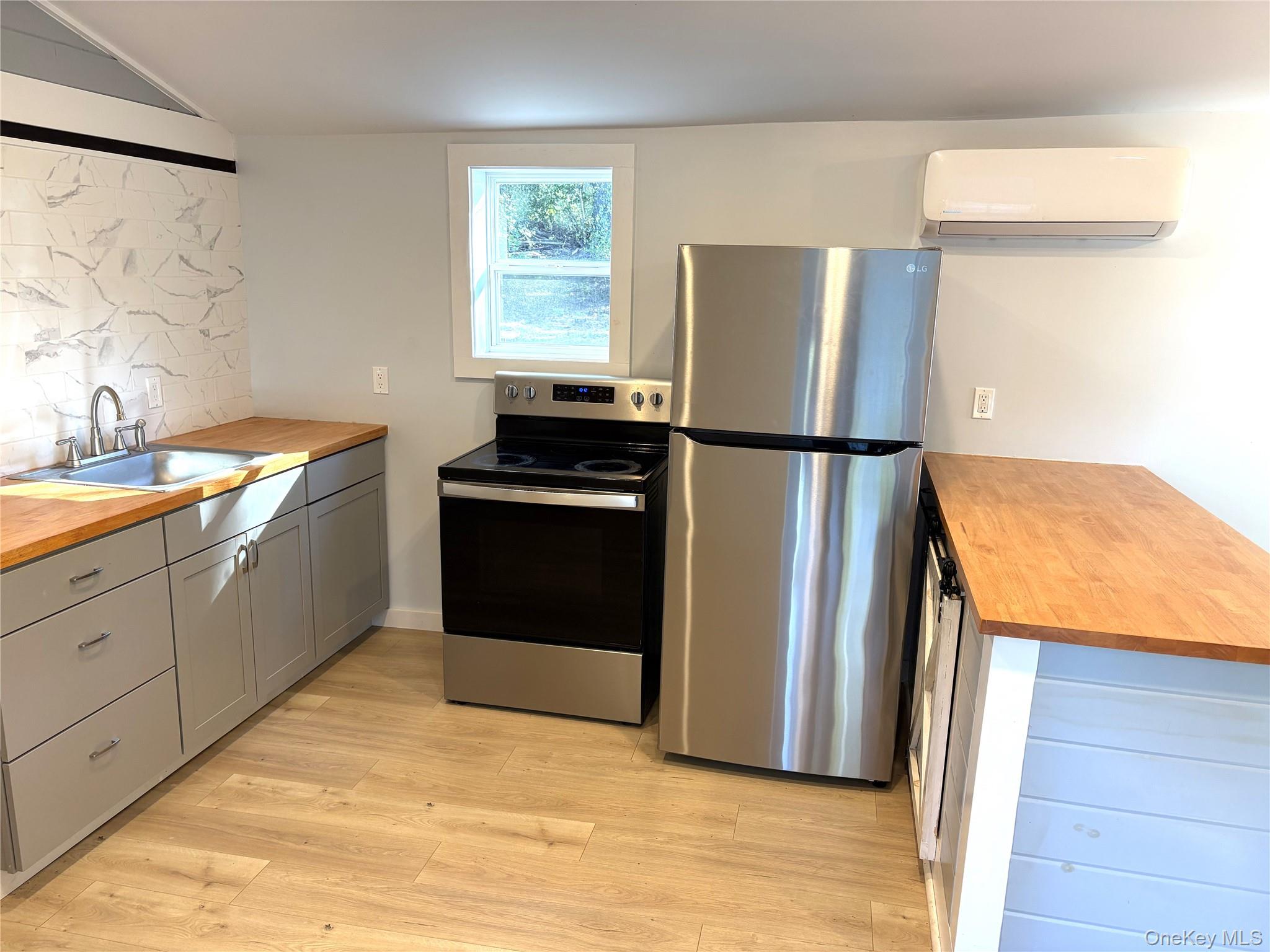 351 Co Rte 19 Hudson, NY 12534 - Photo 9 of 26 a kitchen with a refrigerator sink and cabinets