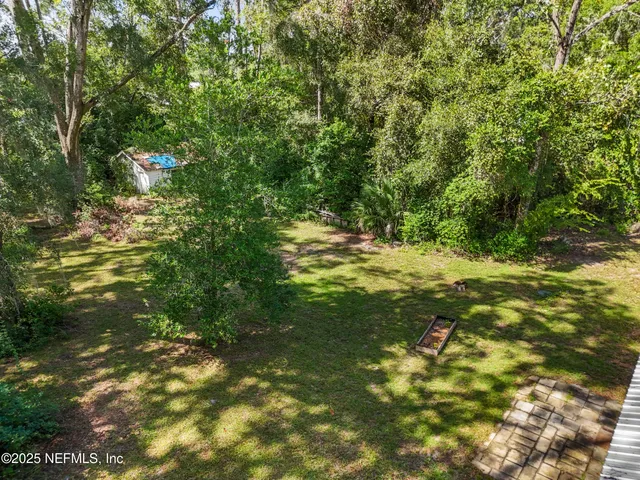 a picture of a bathroom with a shower
