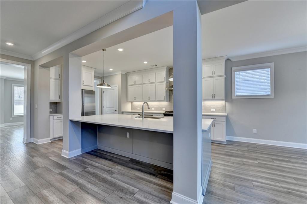3445 Benedict Place Suwanee, GA 30024 - Photo 13 of 59 a bathroom with a sink and a mirror