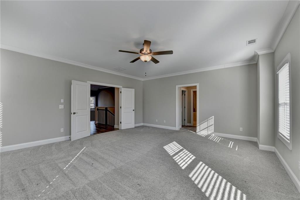 3445 Benedict Place Suwanee, GA 30024 - Photo 34 of 59 a view of livingroom with hardwood floor and a ceiling fan