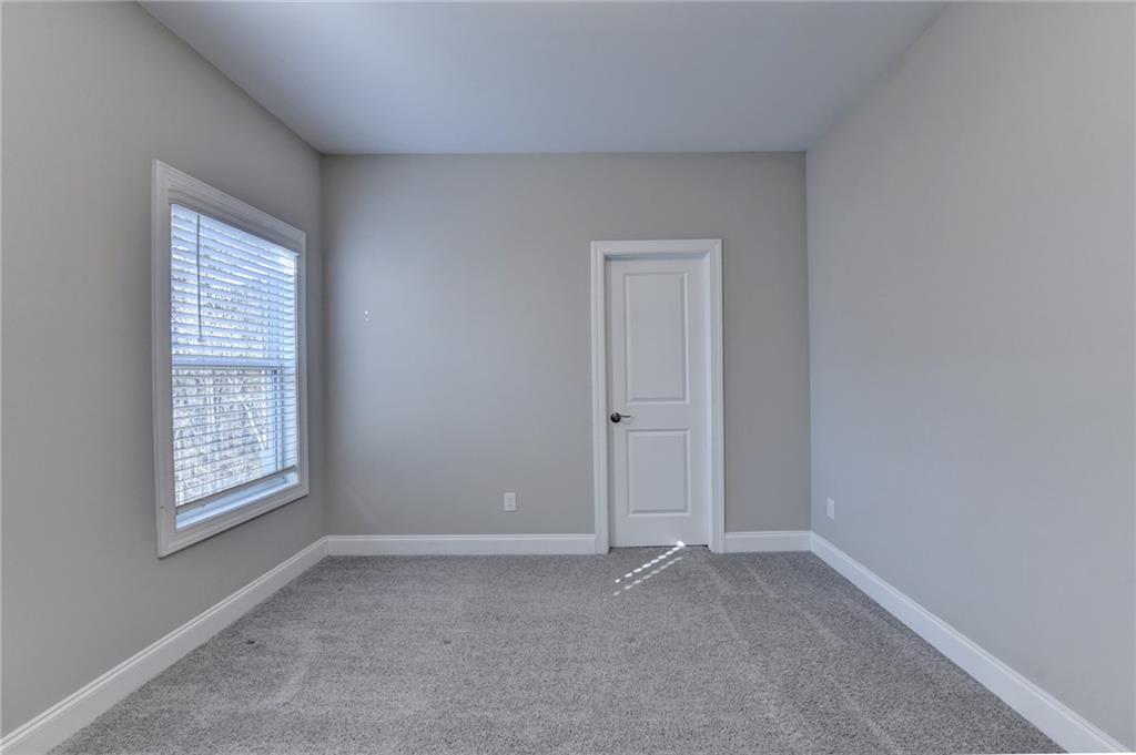 3445 Benedict Place Suwanee, GA 30024 - Photo 42 of 59 an empty room with windows and closet