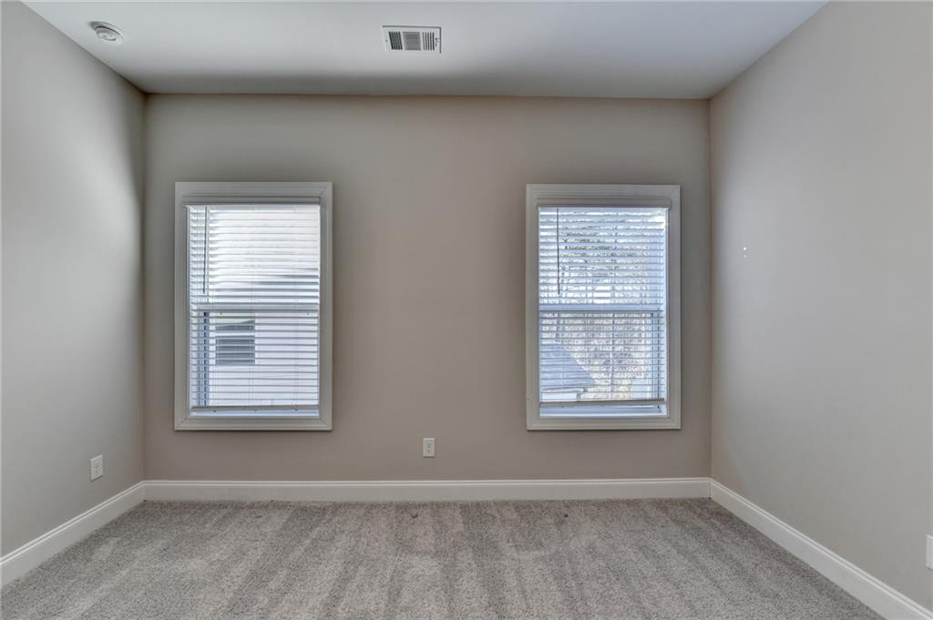 3445 Benedict Place Suwanee, GA 30024 - Photo 43 of 59 a view of an empty room with a window
