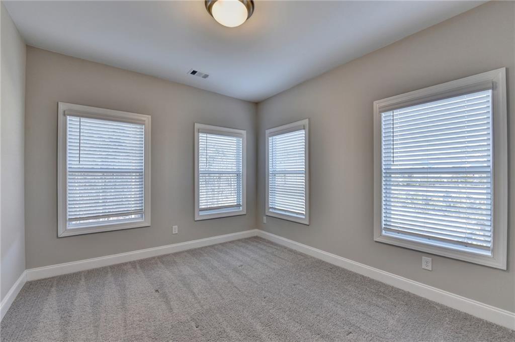 3445 Benedict Place Suwanee, GA 30024 - Photo 45 of 59 an empty room with windows