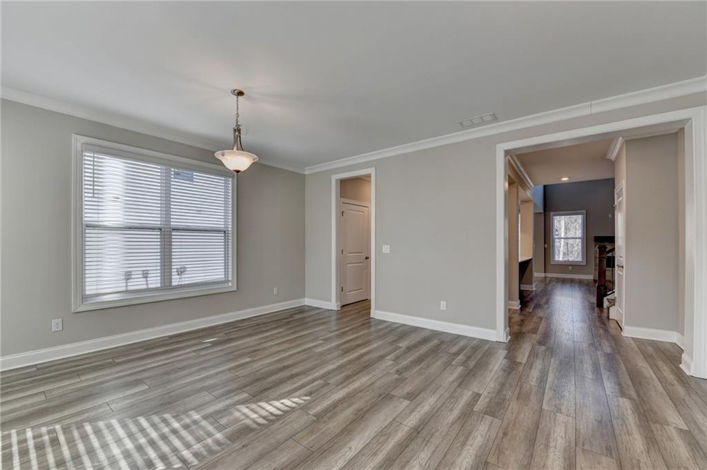 3445 Benedict Place Suwanee, GA 30024 - Photo 6 of 59 a view of livingroom with hardwood floor and window