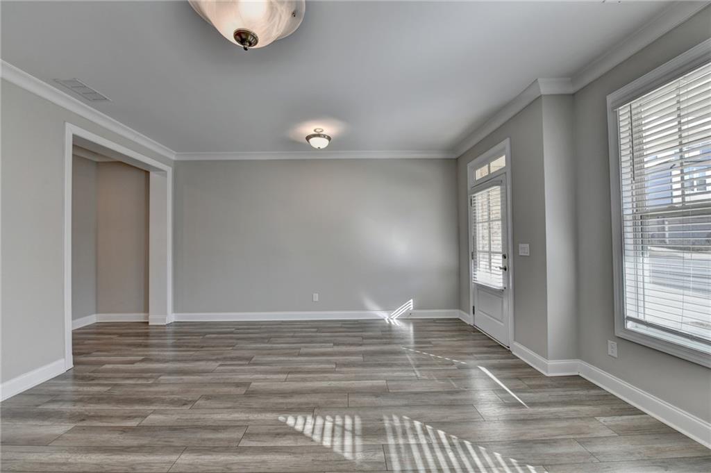 3445 Benedict Place Suwanee, GA 30024 - Photo 7 of 59 a view of livingroom with window and hardwood floor