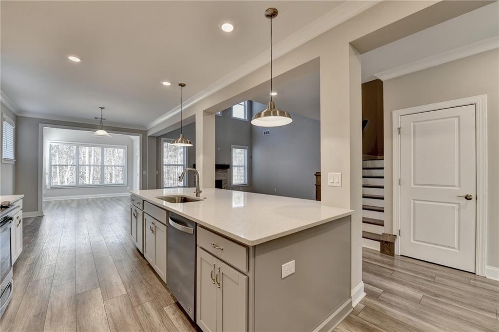 3445 Benedict Place Suwanee, GA 30024 - Photo 8 of 59 a kitchen that has a lot of cabinets in it