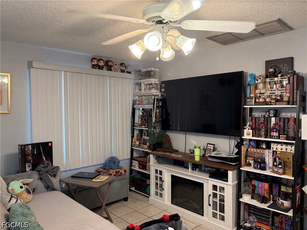2175 Twin Brooks Road North Fort Myers, FL 33917 - Photo 21 of 27 a living room with furniture and a flat screen tv