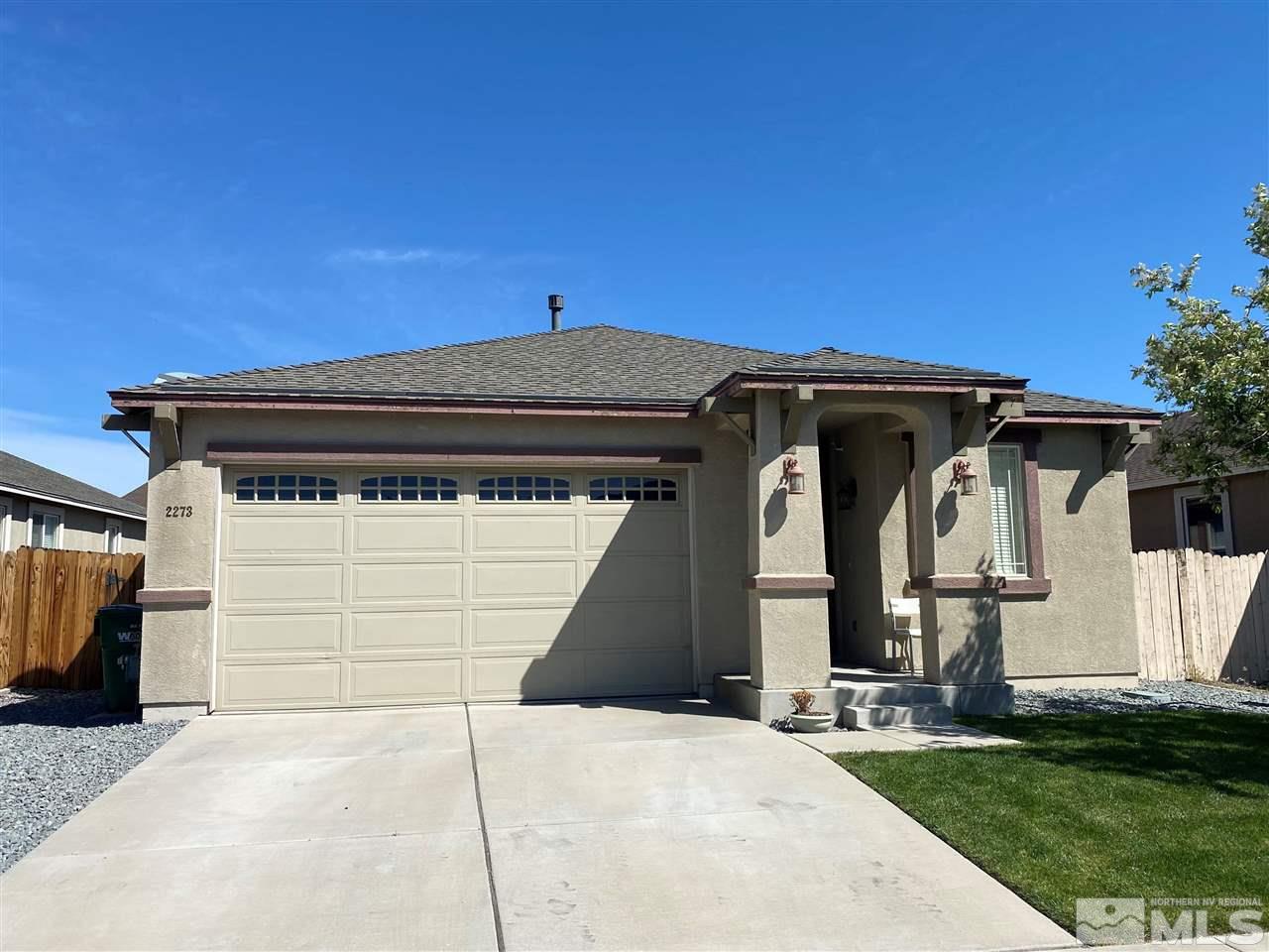 2273 Rio Lobo Lane Reno, NV 89521 - Photo 1 of 1 a front view of a house with garage