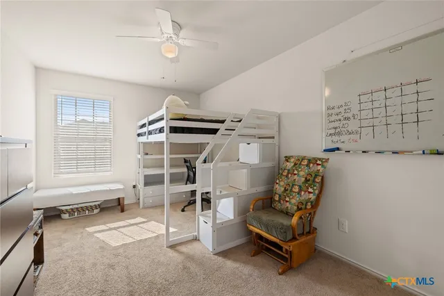 a living room with a furniture and a window
