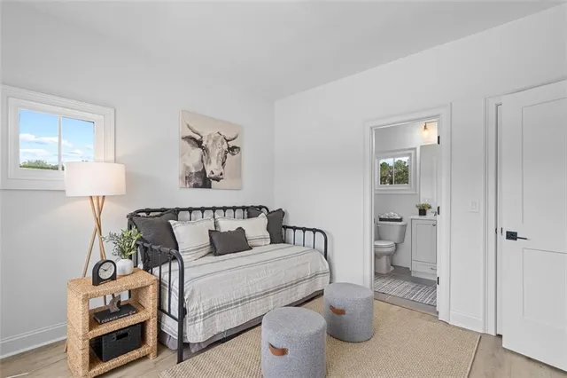 a spacious bedroom with a large bed and a desk