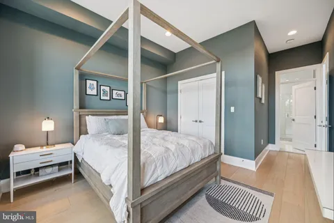 a bedroom with a bed and a lamp