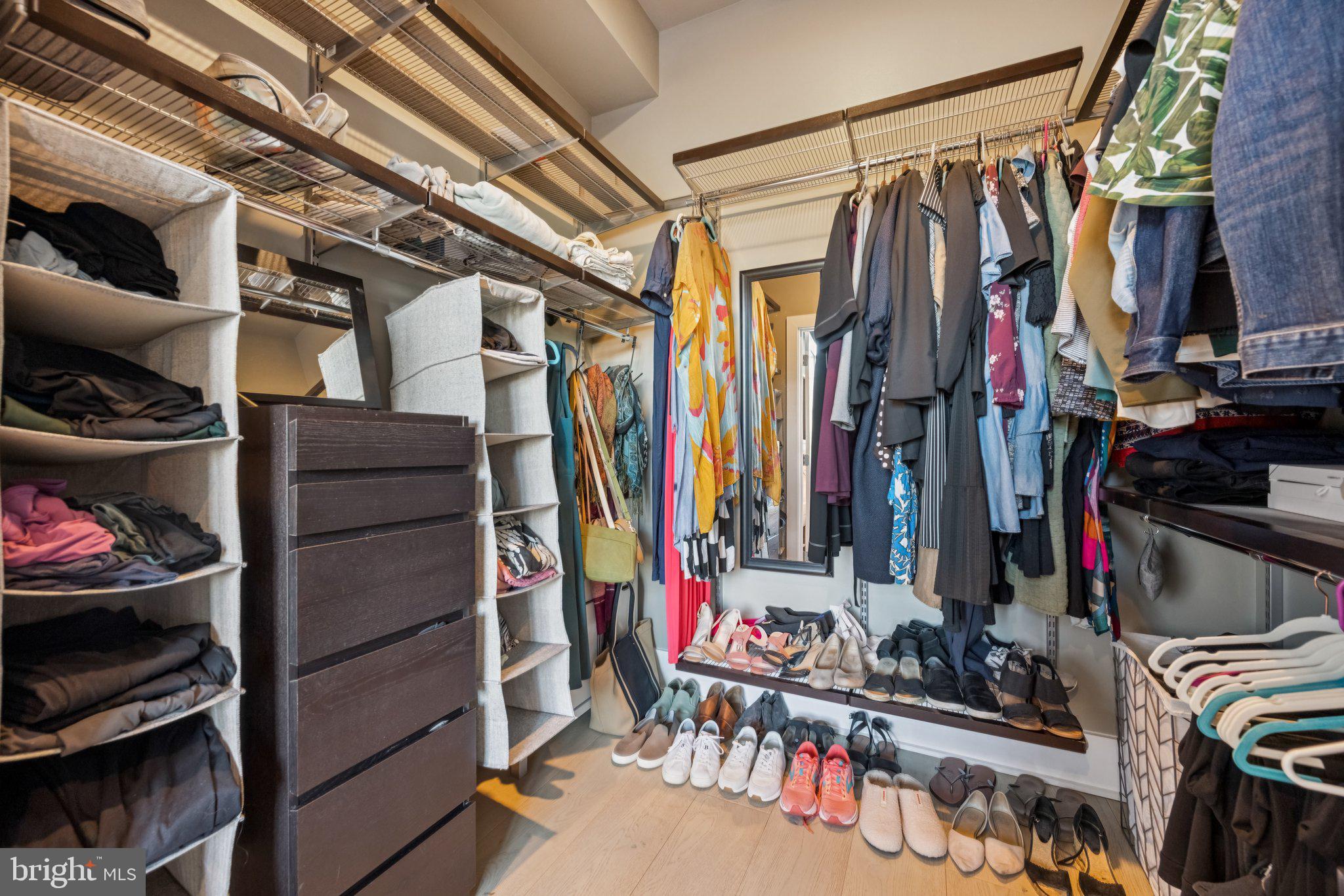 1316 Shepherd Street Northwest, Unit 4 Washington, DC 20011 - Photo 12 of 25 a view of walk in closet with clothes and shoes