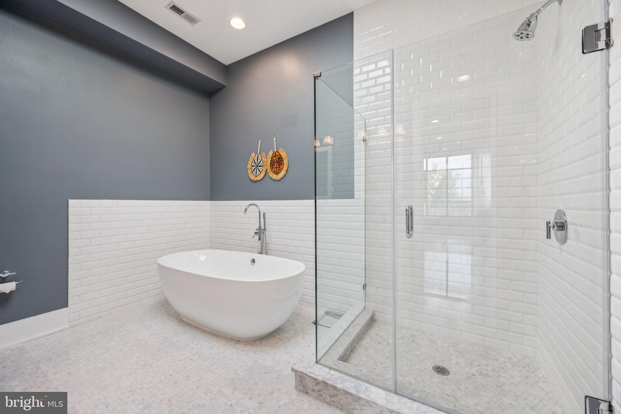 1316 Shepherd Street Northwest, Unit 4 Washington, DC 20011 - Photo 15 of 25 a bathroom with a sink a mirror and a shower