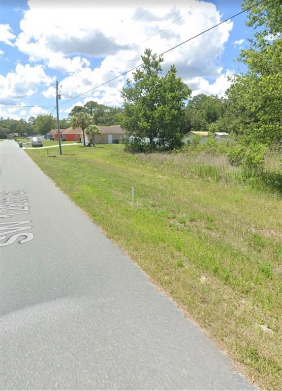 128 Southwest Sw Street Ocala, FL 34473 - Photo 2 of 2 a view of a lake with a big yard