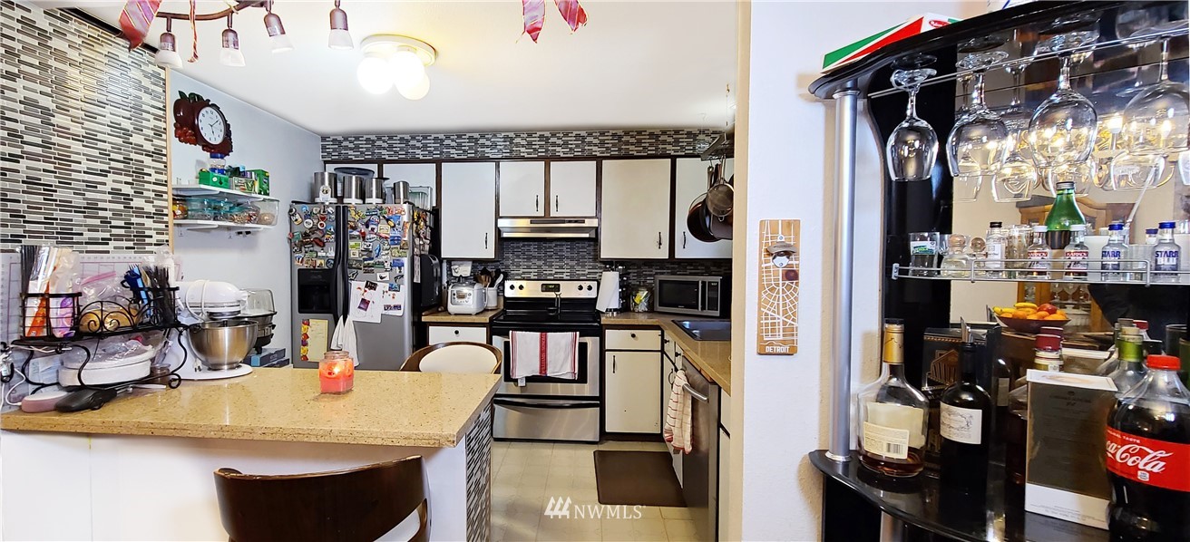 2304 Southeast 21st Street Renton, WA 98055 - Photo 11 of 19 a kitchen with a sink appliances and cabinets