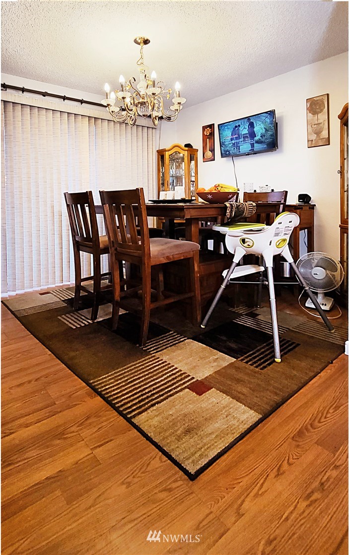 2304 Southeast 21st Street Renton, WA 98055 - Photo 14 of 19 a view of a dining room with furniture and chandelier